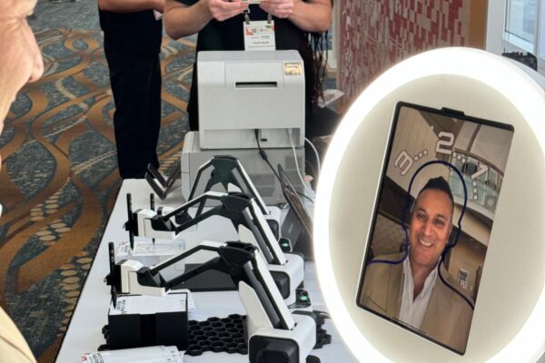 Person taking a photo on the Sketchbot selfie pod