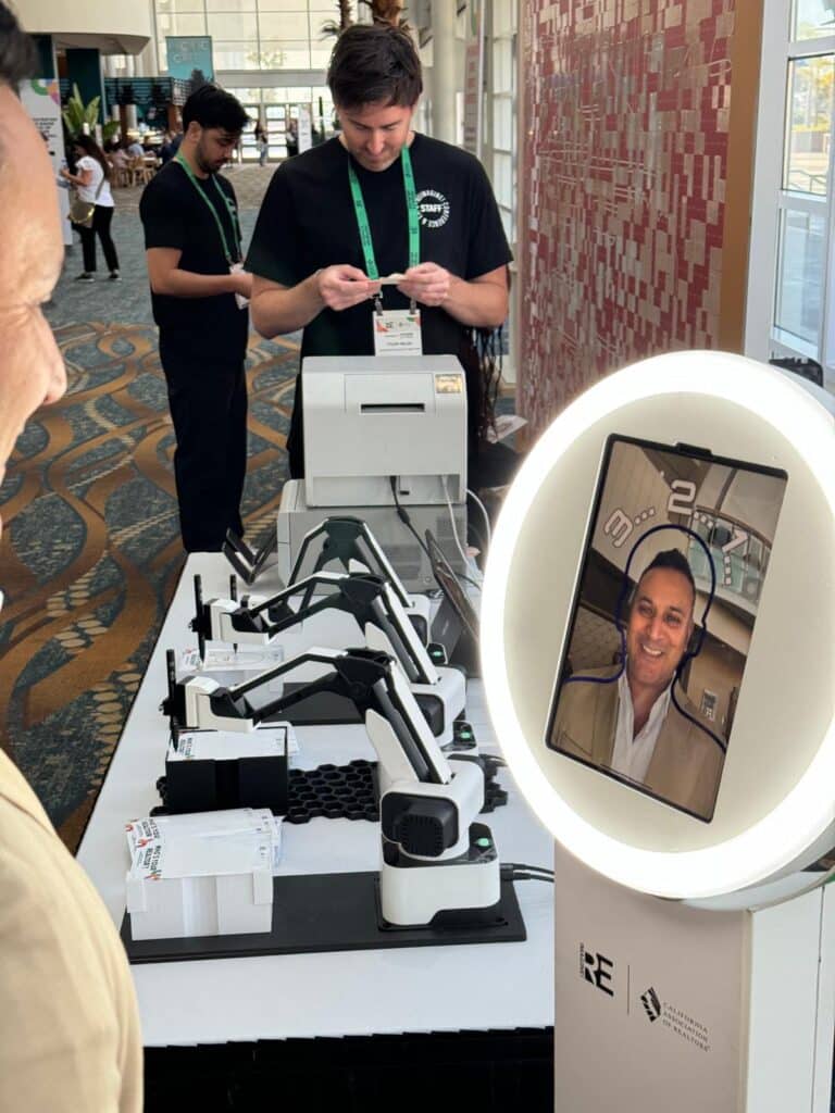 Person taking a photo on the Sketchbot selfie pod