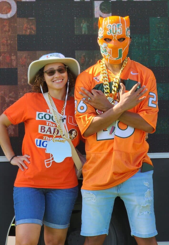 Couple posing in front of the camera for the University of Miami & City National Bank Photo Mosaic Wall