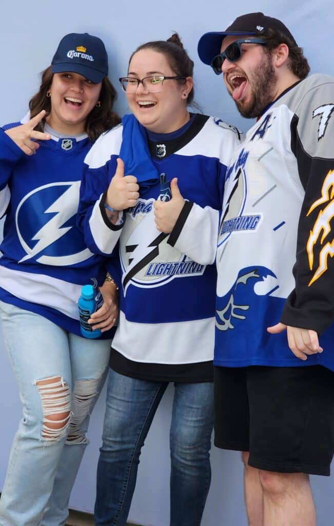 Group of friends taking theor picture for the Tampa Bay Lightning Game