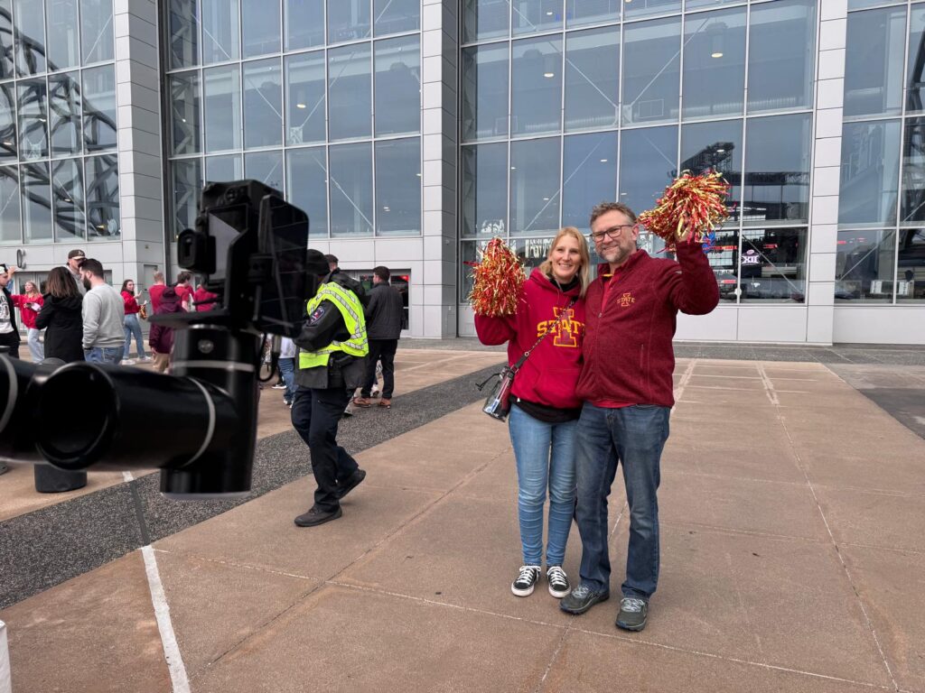 Couple enjoying the Glambot at the Old Trapper Big 12 Booth
