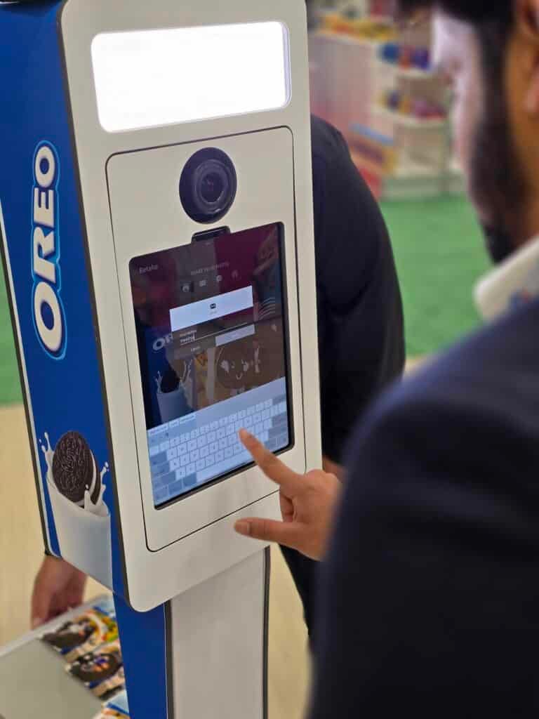 Someone typing their information on the Photo Booth screen