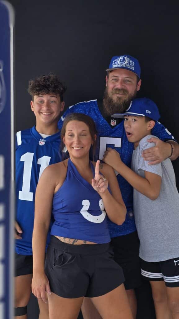 Happy family taking teir photo at Colts Training Camp 2025