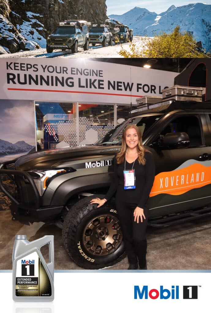Photo of a pretty lady standing in front of the Mobil 1 Truck