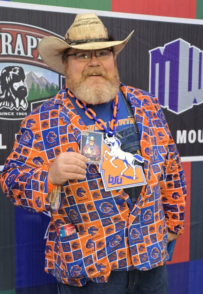Well-dresssed guy with his own trading card at Boise State Vs. UNLV game