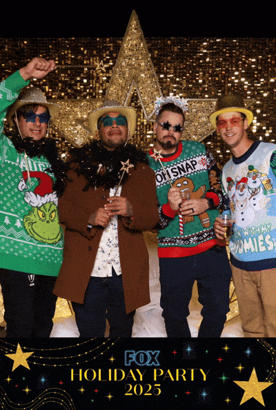 Gif of four guys dressed in their chritsmas sweaters having fun