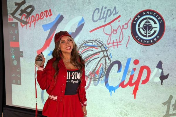 A beatiful woman whi just finished her LA Clippers artwork at NBA All stars 2026