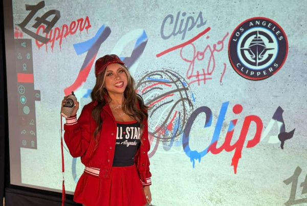 A beatiful woman whi just finished her LA Clippers artwork at NBA All stars 2026