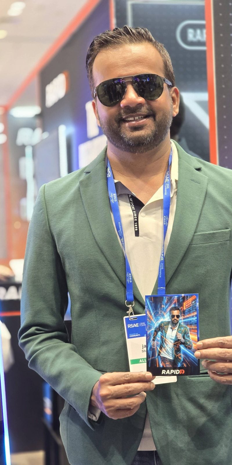 RSAC 2026 04 A man in a suit holding his Rapid 7 print at the RSAC 2026