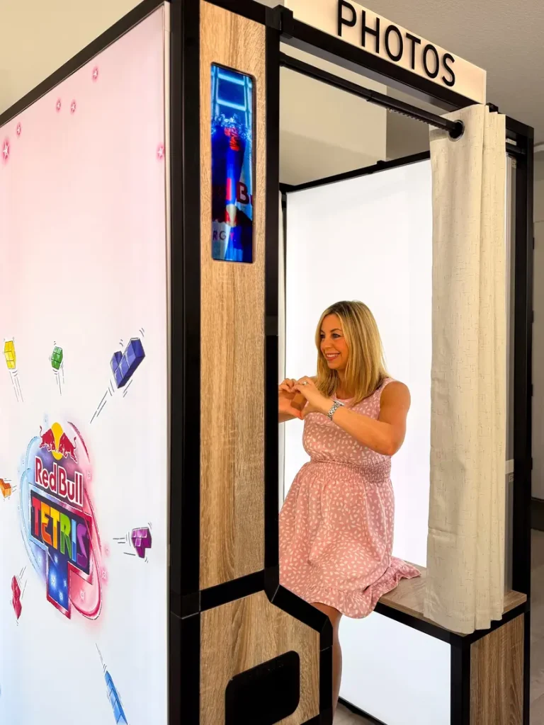 enclosed-booth2026-16 A lady sitting inside the Enclosed Photo booth