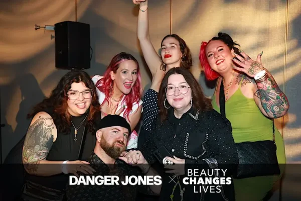 A big group of people posing for the roaming camera man