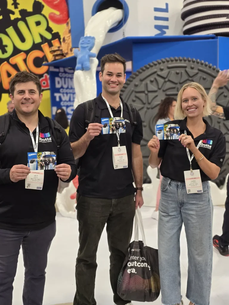 A group of three people holding their oreo photo prints